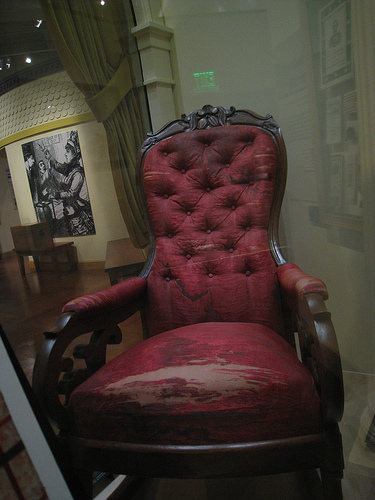 Bloodstains and all, the chair in which Abraham Lincoln was assassinated resides in the Henry Ford Museum in Dearborn, Mich.